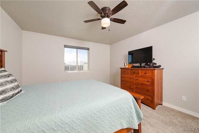 bedroom featuring ceiling fan and light colored carpet