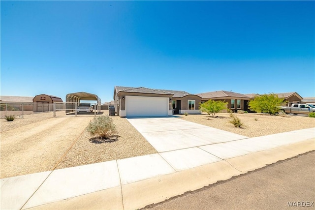 view of front of property with a gate, a carport, fence, concrete driveway, and stucco siding