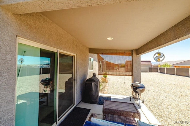 view of patio / terrace featuring fence and an outdoor hangout area