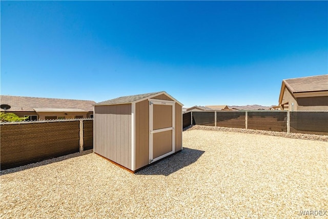 view of shed with a fenced backyard