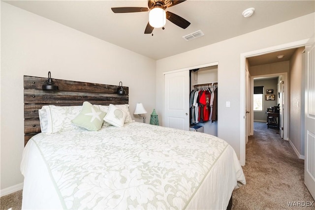 bedroom featuring light colored carpet, baseboards, visible vents, and a closet