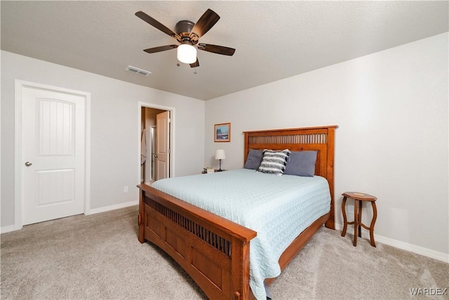 bedroom featuring light colored carpet, baseboards, and visible vents