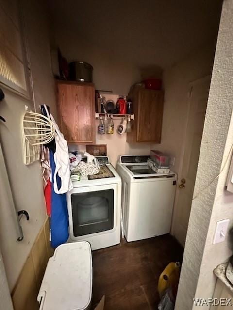 laundry room with washer and clothes dryer and cabinet space