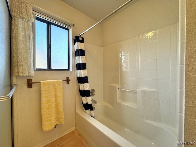 bathroom featuring tile patterned flooring and shower / tub combo with curtain