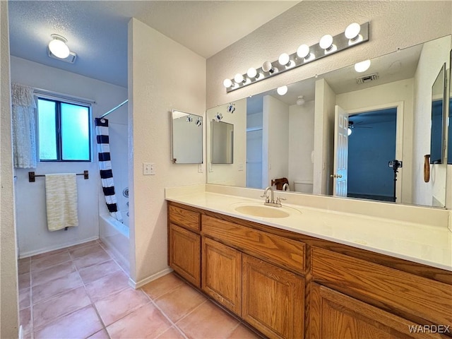 full bathroom with toilet, vanity, visible vents, tile patterned floors, and shower / bath combination with curtain