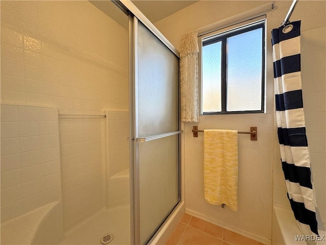 full bathroom featuring a shower with shower curtain and tile patterned flooring