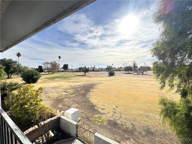 view of yard with a rural view