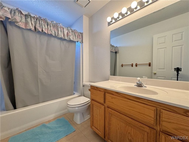 bathroom featuring shower / tub combo, tile patterned flooring, vanity, and toilet