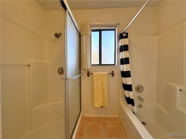 bathroom featuring tile patterned flooring, baseboards, and shower / bath combination with curtain