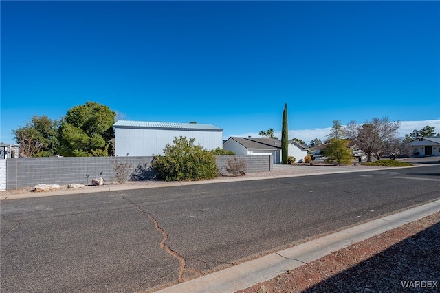 view of road with curbs and a residential view