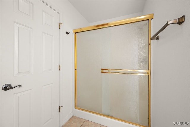 full bath with tile patterned flooring and an enclosed shower