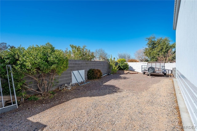 view of yard featuring a fenced backyard