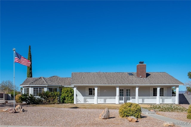 view of front facade with a chimney