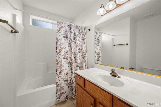 full bathroom with toilet, shower / tub combo, vanity, visible vents, and tile patterned floors