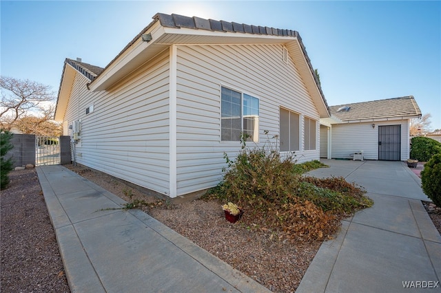 view of property exterior with a gate