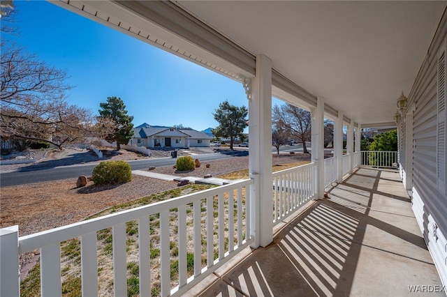 balcony featuring a porch and a residential view