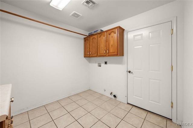 laundry room featuring cabinet space, visible vents, gas dryer hookup, washer hookup, and electric dryer hookup