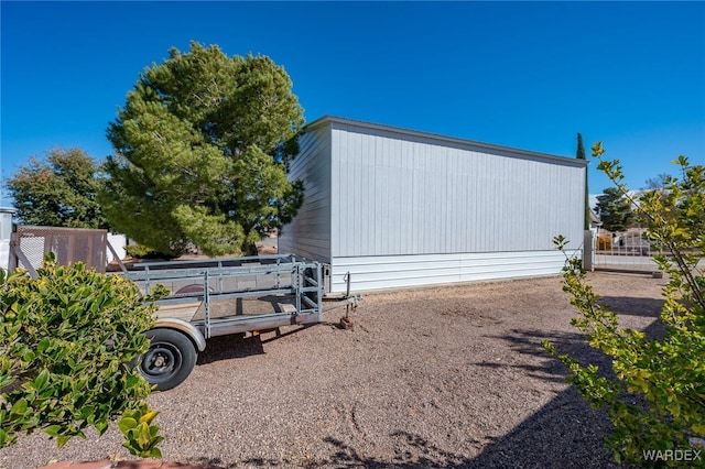 view of home's exterior featuring fence