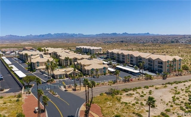 birds eye view of property with a residential view and a mountain view