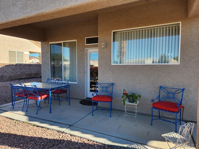 view of patio / terrace featuring outdoor dining space and fence