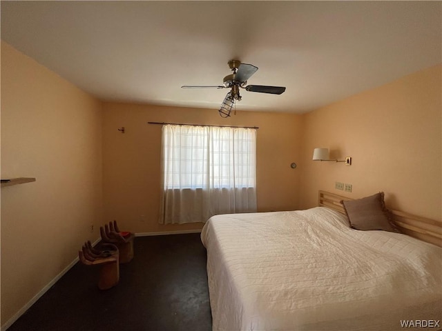 bedroom featuring dark colored carpet, a ceiling fan, and baseboards