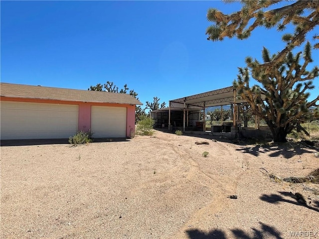 exterior space featuring an outbuilding and a garage