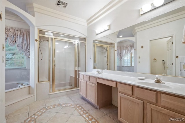 full bathroom featuring visible vents, a stall shower, a sink, tile patterned flooring, and a bath