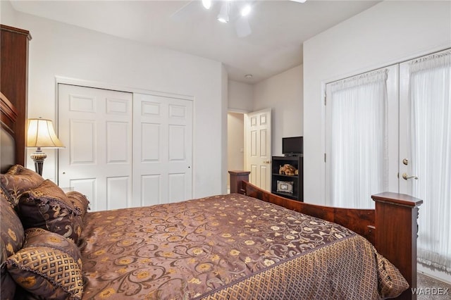 bedroom with a ceiling fan and a closet