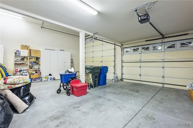 garage featuring a garage door opener