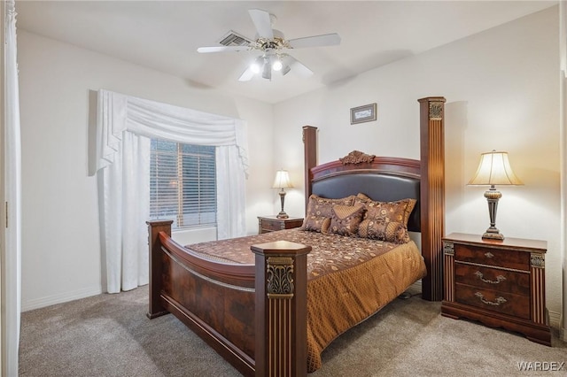 bedroom featuring a ceiling fan and light colored carpet