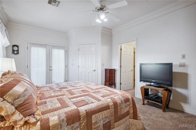 bedroom featuring ornamental molding, french doors, visible vents, and light carpet