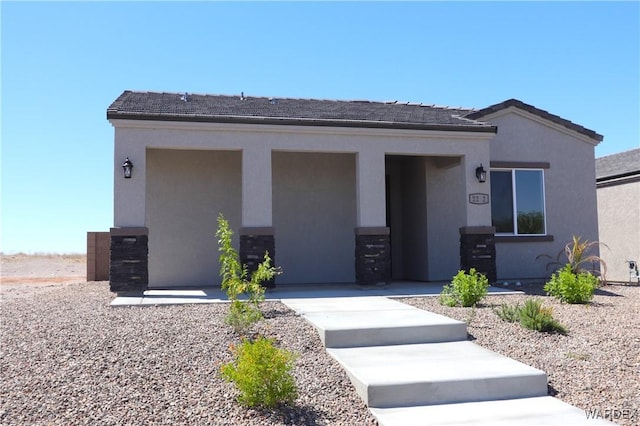 view of front of property featuring stucco siding