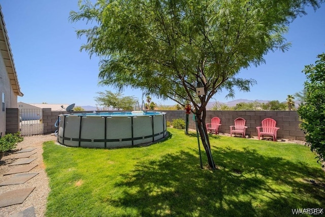 view of yard featuring a fenced backyard and a fenced in pool