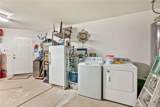 washroom with laundry area and washing machine and dryer