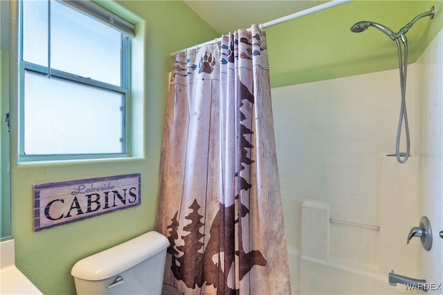 bathroom featuring toilet and shower / bath combo