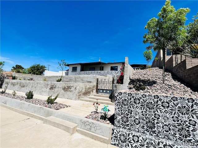 exterior space with a fenced front yard