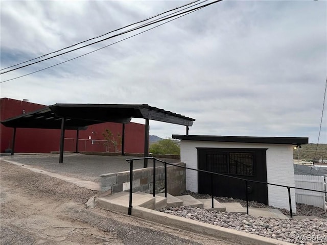 view of outdoor structure featuring fence