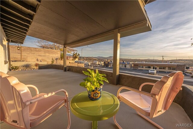 view of patio featuring fence