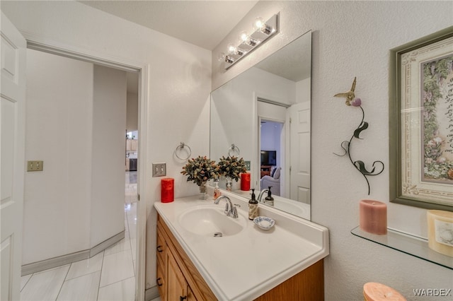 bathroom with tile patterned flooring and vanity