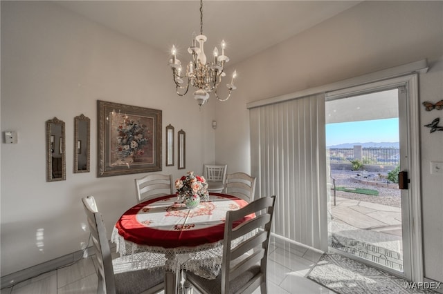 dining room with baseboards and an inviting chandelier