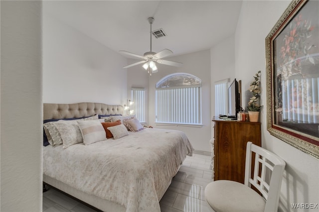 bedroom featuring visible vents, vaulted ceiling, and ceiling fan