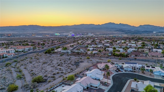 aerial view featuring a mountain view and a residential view