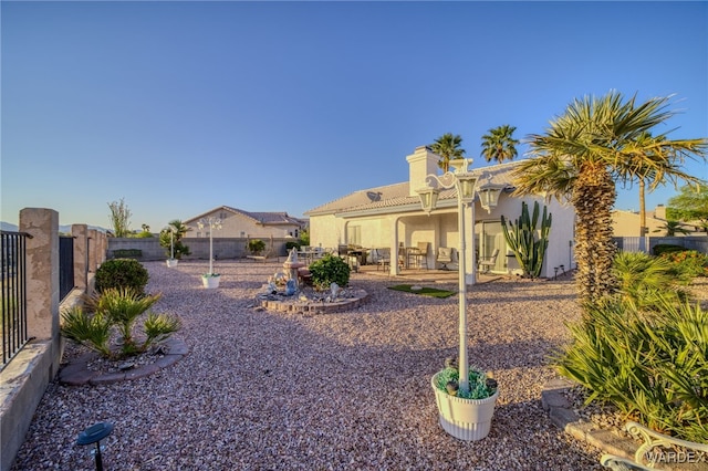 exterior space with a fenced backyard and a patio area