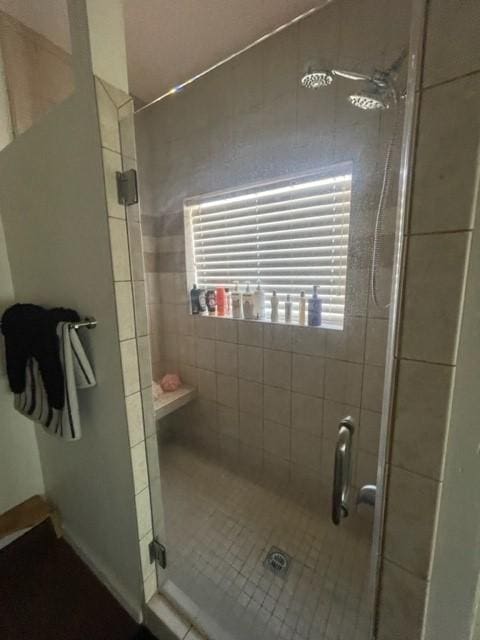 bathroom with a shower stall