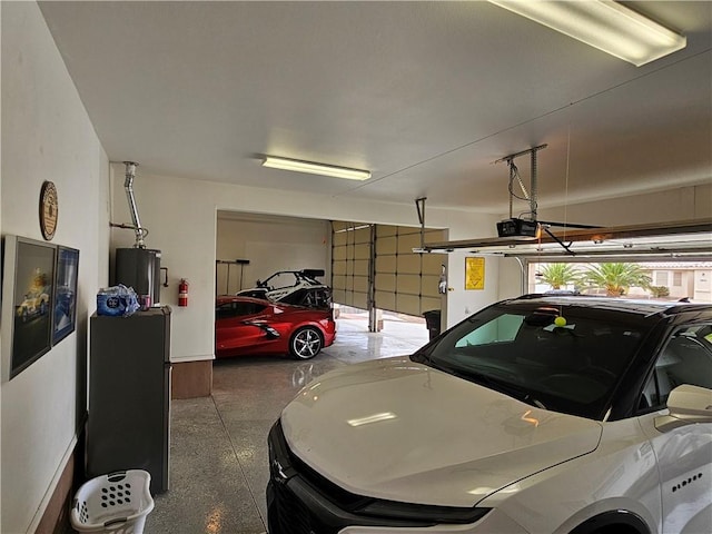 2084 E Crystal Dr, Fort Mohave, AZ 86426 - garage with water heater, a garage door opener, and baseboards