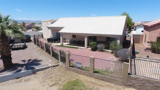 2084 E Crystal Dr, Fort Mohave, AZ 86426 - back of property featuring a tile roof, stucco siding, and a patio