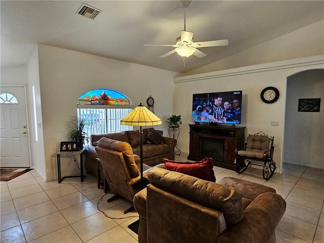 2084 E Crystal Dr, Fort Mohave, AZ 86426 - living area with light tile patterned floors, lofted ceiling, a ceiling fan, and arched walkways