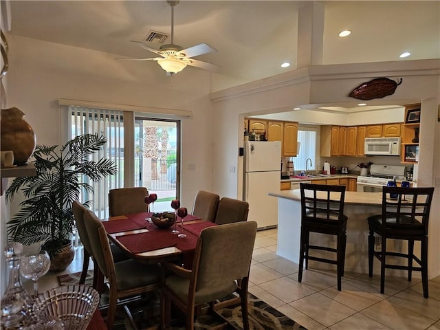 2084 E Crystal Dr, Fort Mohave, AZ 86426 - dining area with light tile patterned floors, a ceiling fan, and recessed lighting