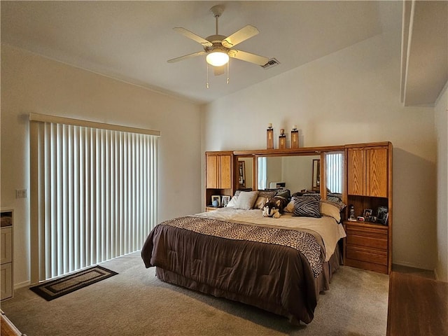 2084 E Crystal Dr, Fort Mohave, AZ 86426 - bedroom featuring light carpet, vaulted ceiling, and ceiling fan