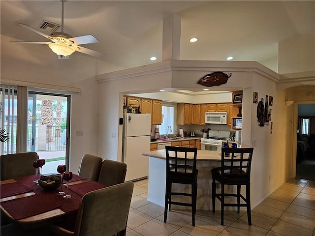 2084 E Crystal Dr, Fort Mohave, AZ 86426 - dining space with light tile patterned floors, a ceiling fan, recessed lighting, and vaulted ceiling